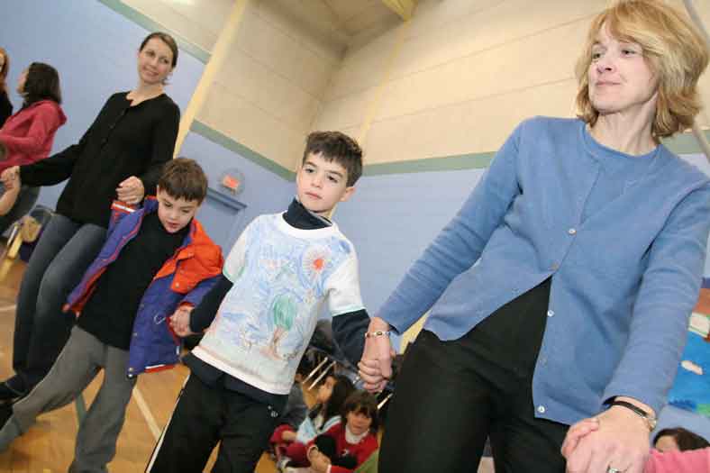 Kelly Fitzsimmons, Ethan Fitzsimmons, Reilly Fitzsimmons, and Terry Moore dance at the end of the powwow.