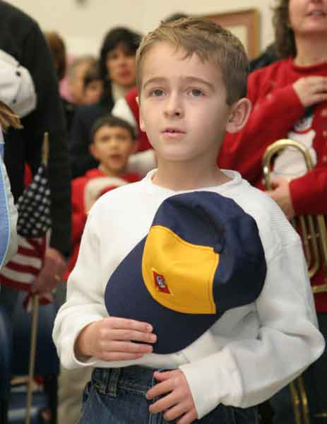 Cub scout Aaron Hawksley recites the Pledge of Allegiance.