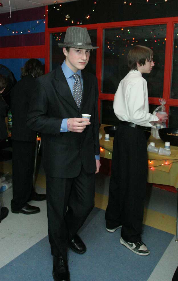 Sporting a fedora, Matt Chambers grabs a snack at the Snowflake.