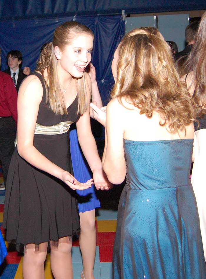 Elizabeth Smetana pauses at the Snowball to talk to a friend.