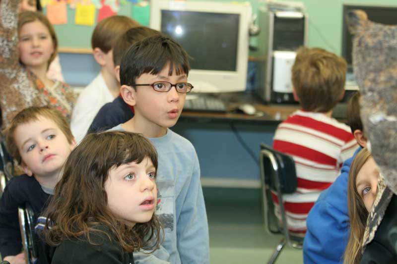 Penelope Schnier, Jack Wilkins, Jessika Antinori, and Max Chadran are mesmerized by a great horned owl.