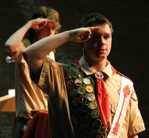 Tom Cooke (foreground) and Nick Ostertag recite the Pledge of Allegiance at the start of their Eagle Scout induction ceremony at Bromfield last Saturday. (Photo by Lisa Aciukewicz)