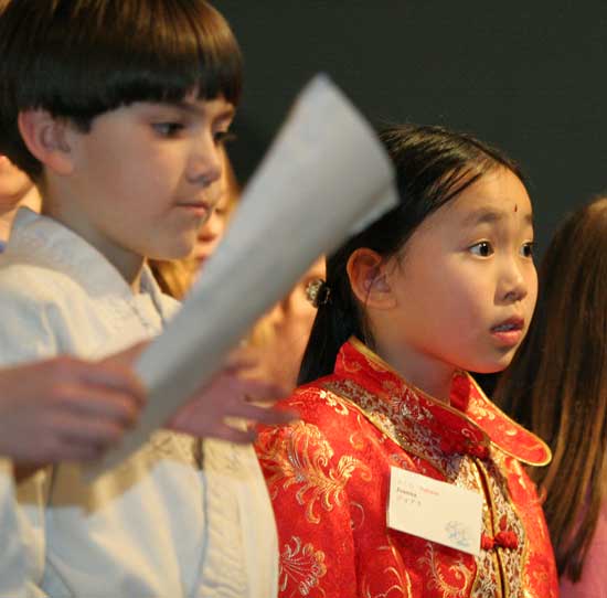 Colin Grant and Joanna Young sing “Sakura” with their third-grade classmates.