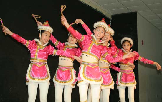 Girls from the Angel Chinese dance troupe peform a Mongolian folk dance, “On Horseback.”