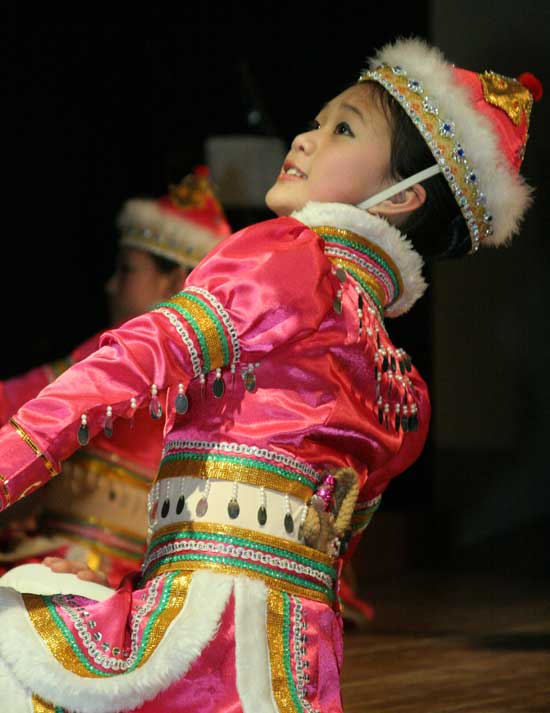 Deidre and Bridgette Kennedy perfA performer from the Angel Chinese dance troupe pauses during a Mongolian folk dance.orm an Irish step dance.