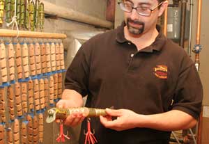 Chris shows off a finished lure. (Photo by Lisa Aciukewicz) Chris shows off a finished lure. (Photo by Lisa Aciukewicz)