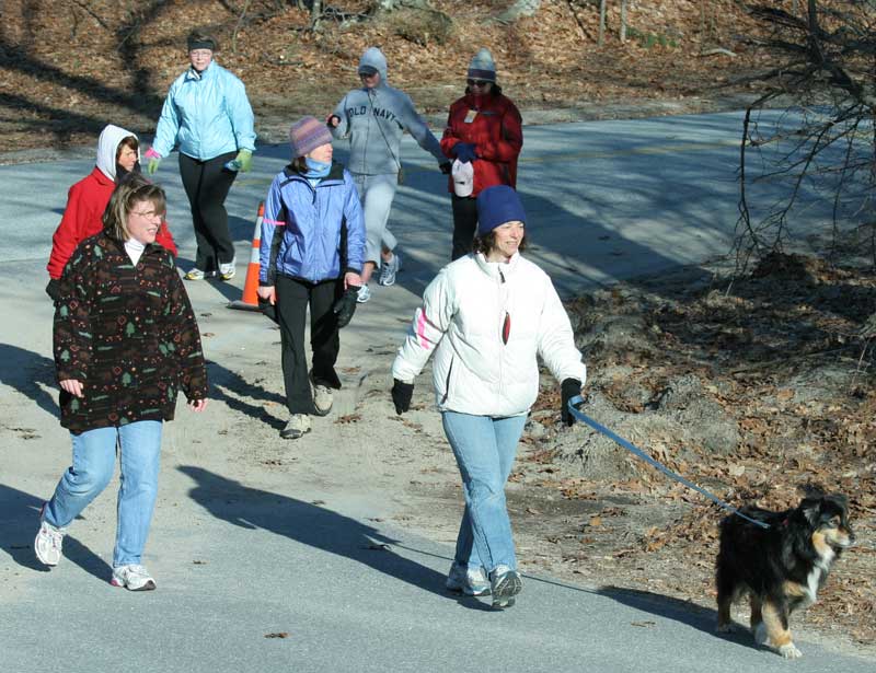 A group of women from the Virginia Thurston Healing Garden walk in the Good Friday walk as a  way to train for the three-day Just ‘Cause walk to find a cure for breast cancer.
