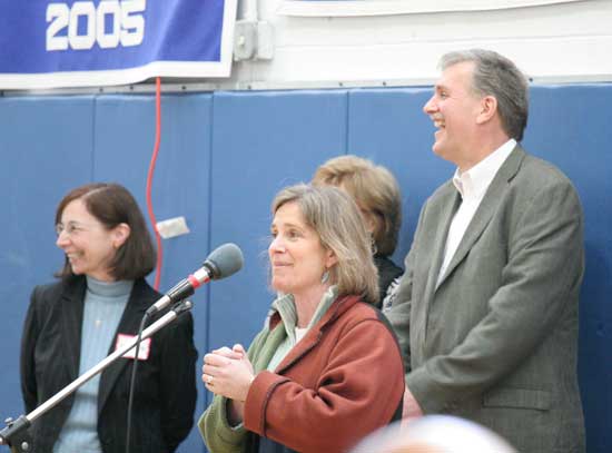 Sharlene Tuttle amuses the crowd at Town Meeting with tales of how hot her second floor classroom gets in the summer months as Lorraine Leonard (left) and Tom Jefferson react.