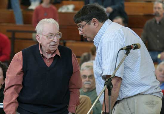 Jeff Harris (left) and Bill Marinelli confer on an amendment to an article.