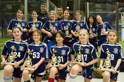 Boys U12 Acton indoor soccer champs. Top Row: Ryan Kennedy, Sammy Swindells, Nate Pappas, Ben L’Ecuyer, Paul Malloy, Nadir Hankour, and Jeremy Sternbach. Bottom Row: Emile Sternbach, Preston Wilkey, Ezra Kraus, and Matt Keefe. Monique Fountaine is the coach in the background. (Courtesy photo)