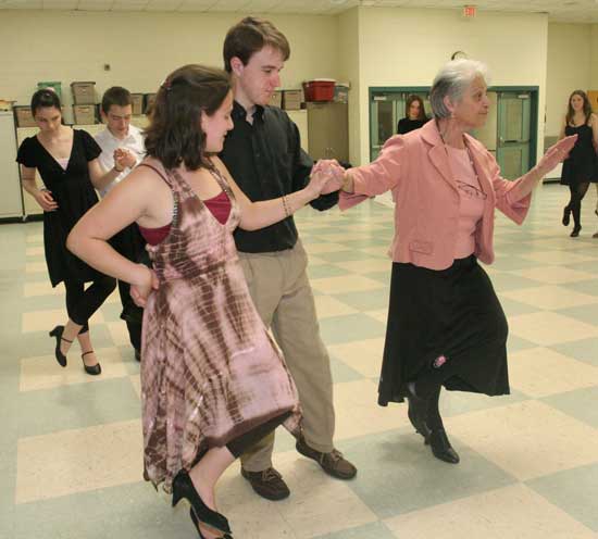 Rita Fagan and Robert Over get a little individual instruction from Phyllis Norton.