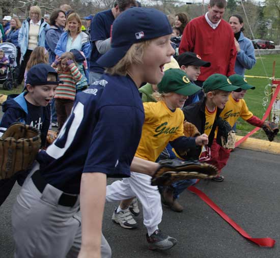 Ryan Boleman leads a group of ballplayers in a race to the day’s activities.