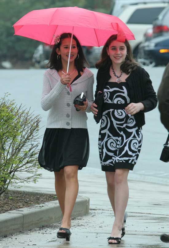 Alyssa Swindells and Stephanie Shea arrive in black and white attire.