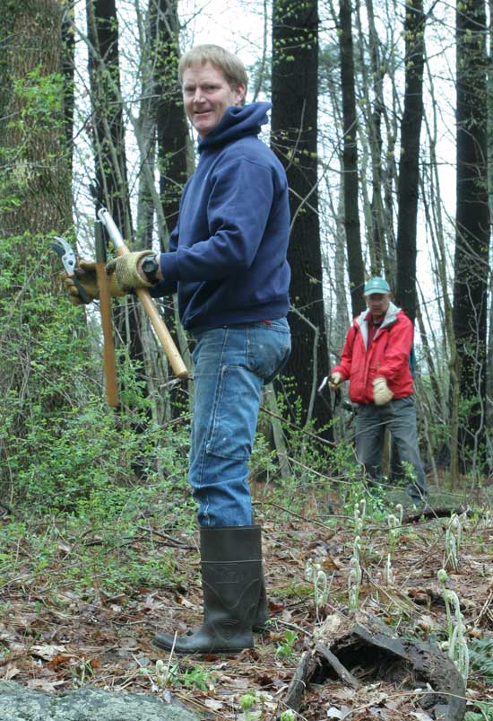 Ned Toll and Phil Knoetner work at clearing a trail.