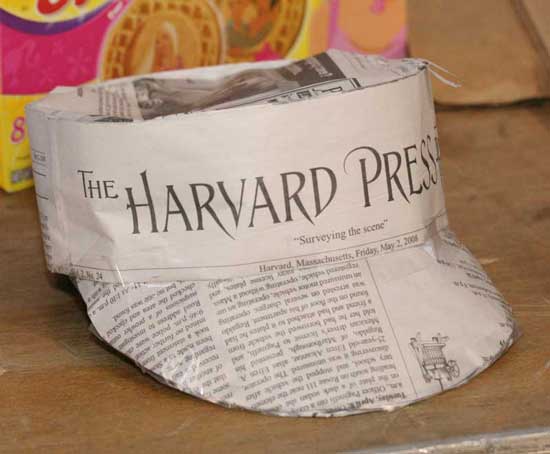 A hat made from recycled newspaper is displayed at the Earth Day fair.