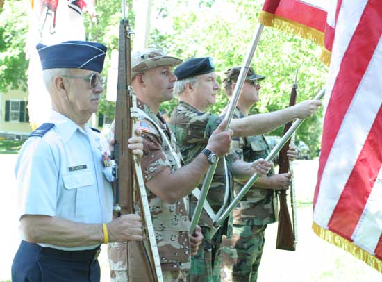 Color guards Jim DeZutter, Oleh Dutkewych, Duncan Chapman, and Steele Kenyon stand at attention