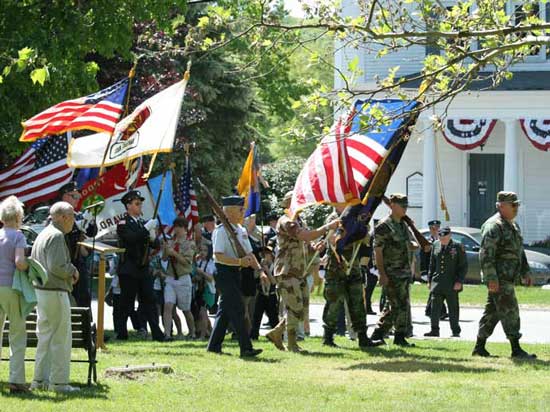 The parade passes across the Common.