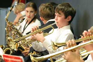 Matt Polimou warms up on his trumpet before the concert starts.