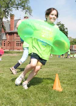 Caroline Hentz flies around a cone during a relay race. 
