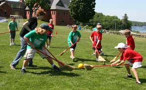 Elementary school students play a high-spirited game of broom ball during their field day on Tuesday. Left to right are Ben Cadman, Evan Cochran, Jared Ravane, Connor Sloan, Connor Cassin, Matt Olejarz, Jimmy Nigzus, and Colin Grant.