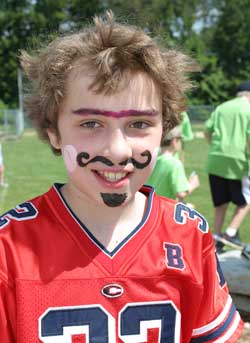 Tommy Jackovitz  sports a new moustache and goatee compliments of the face painters at field day. 
