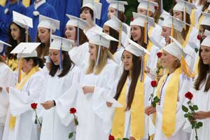 Seniors sing the class song, “With a Little Help from My Friends.”
