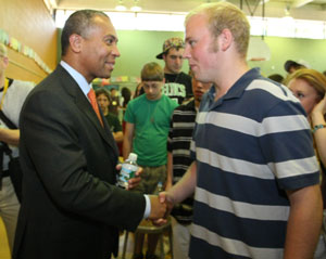 Governor Patrick shakes hands with junior Tim Brown-Cullinane of Littleton County Road.