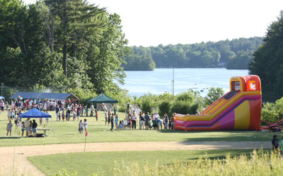 The Fun Fair enjoys a  view of Bare Hill Pond.