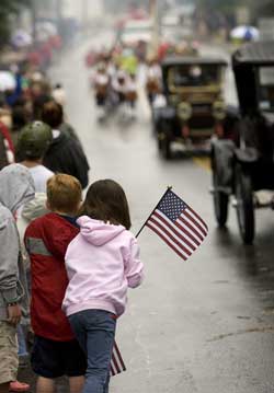 Young spectators enjoyed a front-row view of Friday's parade. (Photo by Ellen Harasimowicz)