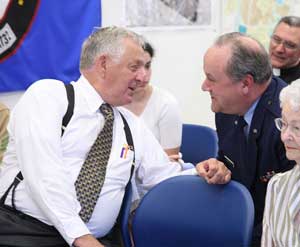 Bob Hughes and Joe Theriault visit before the ceremony.