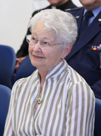 Lucille Martineau watches as her husband receives his military honors.