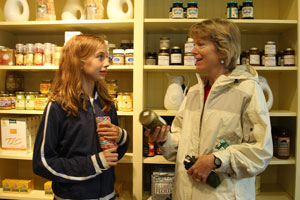 Julie (left) and Jenny Gormley check out jams made by Irene Mannix in the General Store.
