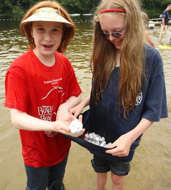 Lauren Beale and Jenny Specht show off their candy stash after the candy hunt at the town beach (Photo by Lisa Aciukewicz)