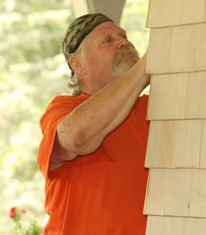 Jim Burrington of the Department of Public Works fills out a raffle ticket for prizes raffled off at the barbeque.