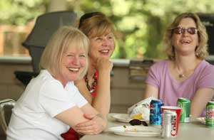 Librarians Mary Wilson, Judy Veno, and Abbey Kingsbury laugh after being told to “keep it down.”