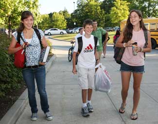 Siblings Emily, Sam, and Brittany Jones walk into Bromfield.