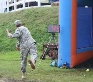Steven Connoly, a National Guardsman who trains at Devens, pitches a ball that clocks in at 43 mph.