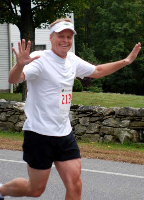 Tom Daniells of West Bare Hill Road waves to his fans.