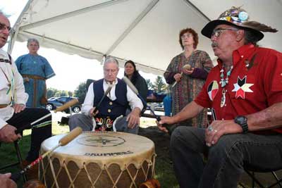 Michael Scelzi, Sandy Shepherd, and Chief Roland Jerome keep the beat during a drumming circle held at Fruitlands museum last Sunday to celebrate Native American culture.