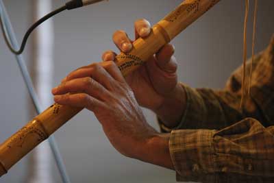 Flute player and storyteller Hawk Henries of the Nipmuc Nation performs songs on a hand-crafted flute.