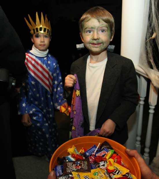 The Statue of Liberty (Natalie O’Leary) and Frankenstein (Alex Jorgenson) ask for a treat.