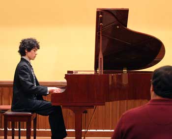 Justin Bartlett plays at last year’s Thanksgiving concert on a piano moved in for the evening. This year he will play on the new Steinway purchased by the Harvard Public Library Trust. (File photo by Lisa Aciukewicz) Justin Bartlett plays at last year’s Thanksgiving concert on a piano moved in for the evening. This year he will play on the new Steinway purchased by the Harvard Public Library Trust. (File photo by Lisa Aciukewicz)