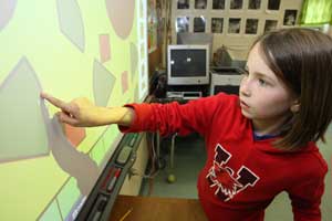 Katie Seavey-Walker uses an interactive whiteboard funded by the Harvard Schools Trust. The Trust funds curriculum enhancement and extracurricular activities for the public schools. (Photo by Lisa Aciukewicz) Katie Seavey-Walker uses an interactive whiteboard funded by the Harvard Schools Trust. The Trust funds curriculum enhancement and extracurricular activities for the public schools. (Photo by Lisa Aciukewicz)
