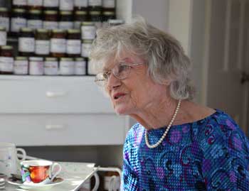 Flanked by a cupboard of her homemade jams and preserves, Irene Mannix talks about her many adventures in and out of the classroom at her home on West Bare Hill Road. (Photo by Lisa Aciukewicz) Flanked by a cupboard of her homemade jams and preserves, Irene Mannix talks about her many adventures in and out of the classroom at her home on West Bare Hill Road. (Photo by Lisa Aciukewicz)