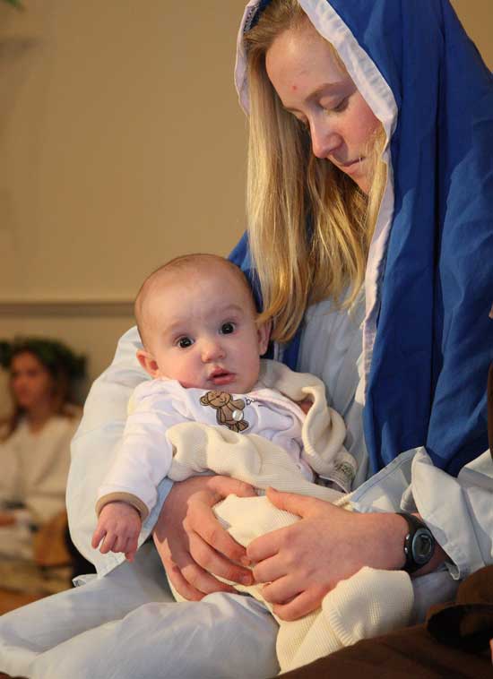 Katelynn Ball as Baby Jesus #2 is held by Erin Molinaro playing Mary.