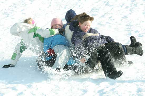 Riley Sennot and friends sled down the hill behind Bromfield in January.