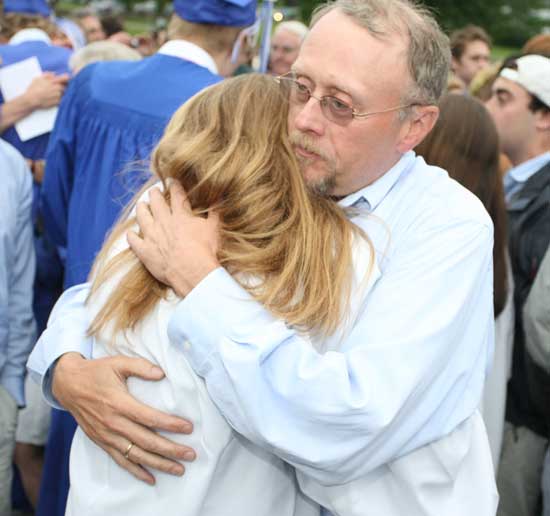 Ray Dunn hugs daughter Bo at Bromfield graduation in June.