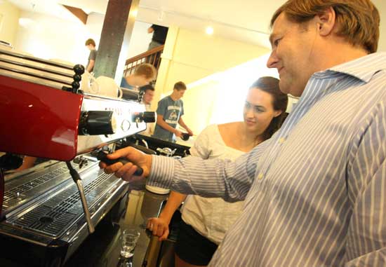 Katie Bolton and Adam Horowitz prepare a cup of espresso at the General Store. The store's long-awaited opening was in June.