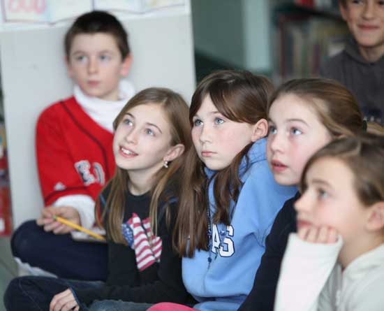 Fifth-graders Ethan Sprague, Olivia Alfieri. Bridie McNamara, Meghanne Fitzsimmons, and Kelsey L'Ecuyer listen to the inaugural address.