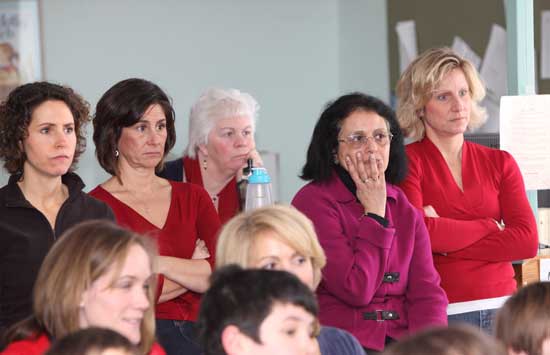 HES teachers Cynthia Ambrosino, Reenie Keith, Ruth Schemel, Sangita Marya, and Christine Reale listen from the back of the room.
